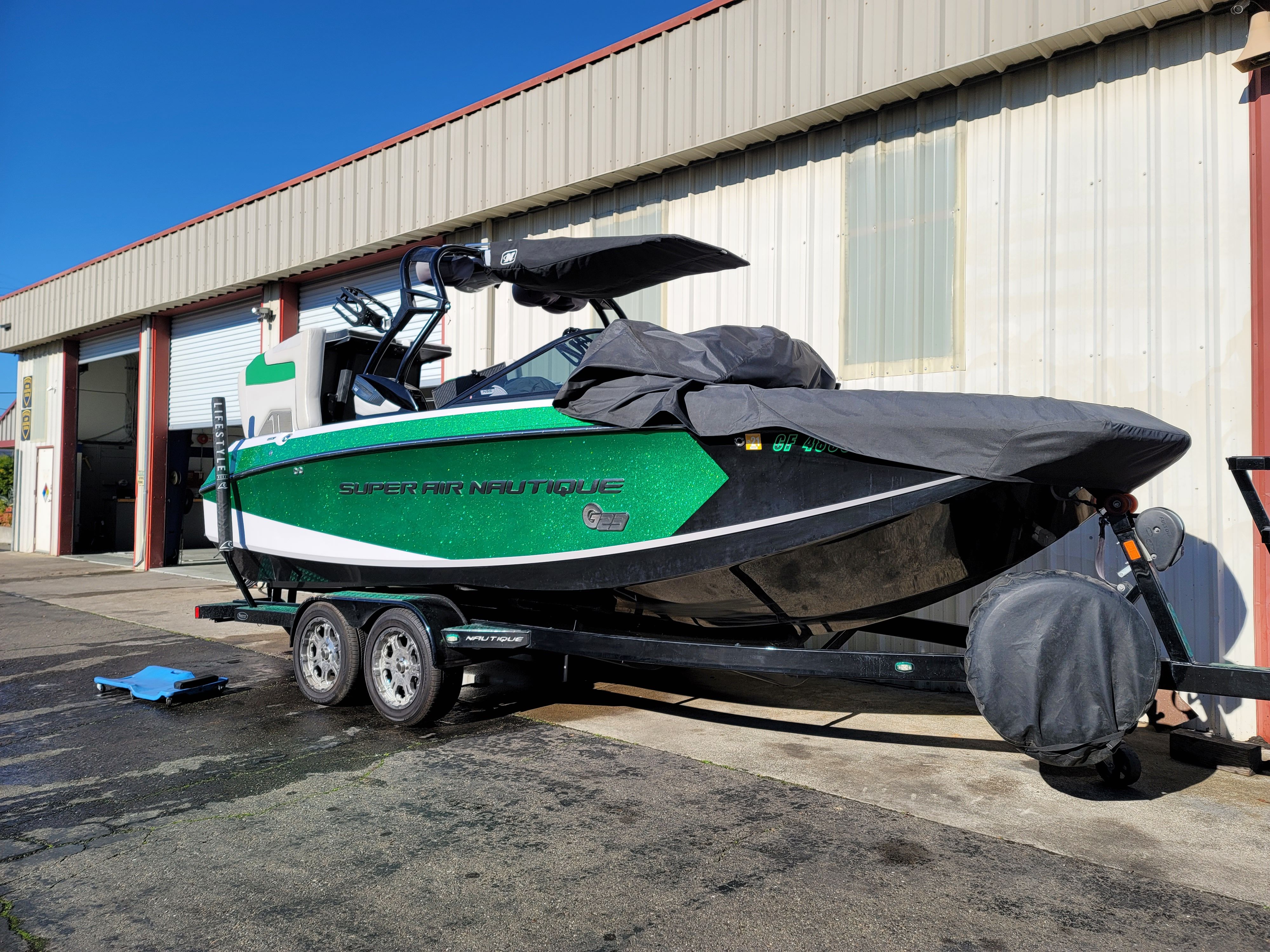Super Air Nautique wake boat on trailer at Hahn Automotive in Santa Rosa for engine and drive service